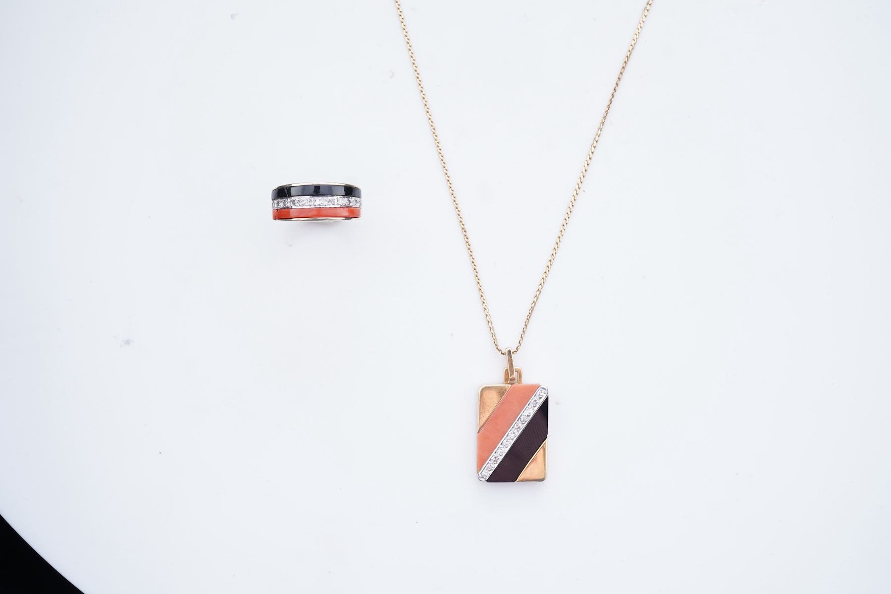 An onyx, coral and diamond demi-parure, circa 1976-7